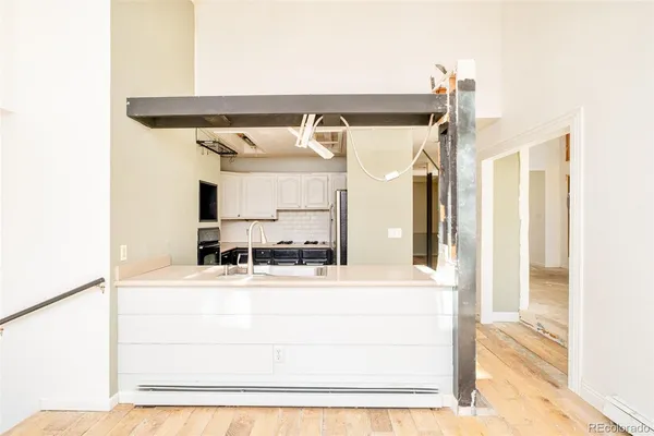 a bathroom with a sink mirror and vanity