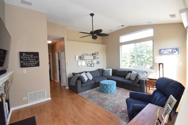 a living room with furniture and a window