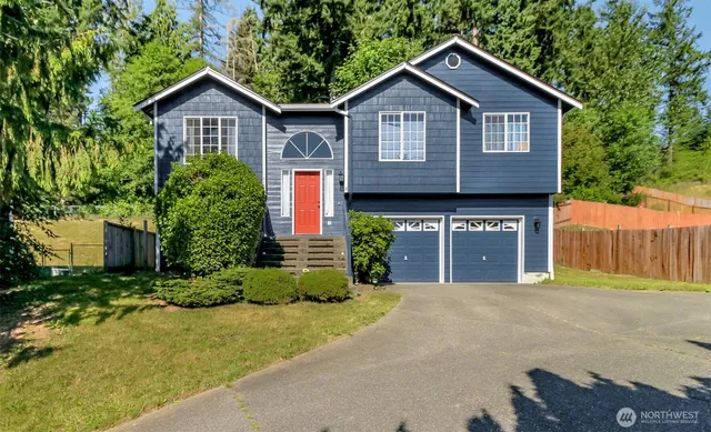 a front view of a house with garden