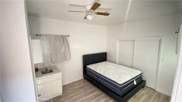 a bedroom with a bed and a table