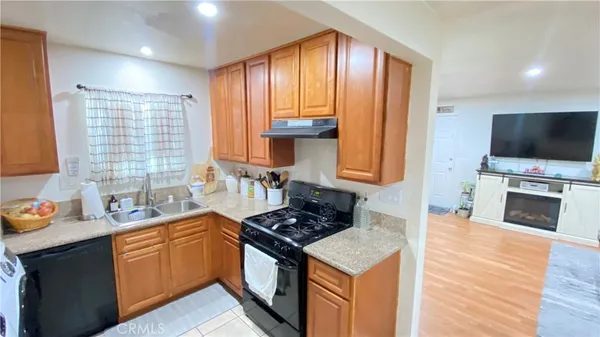 a kitchen with a stove a sink and a microwave