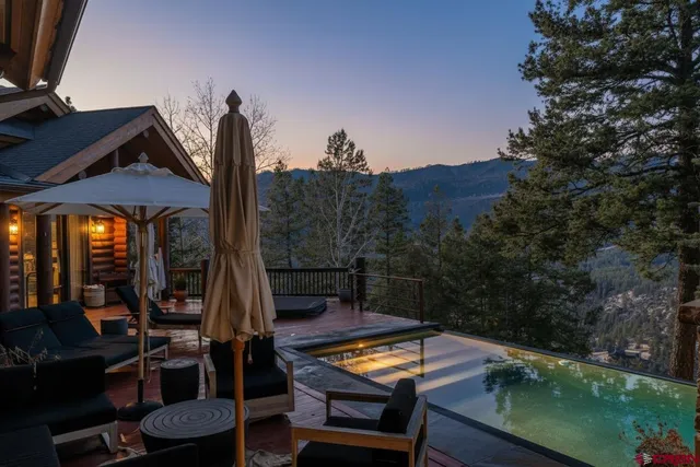a view of a chairs and tables in a patio
