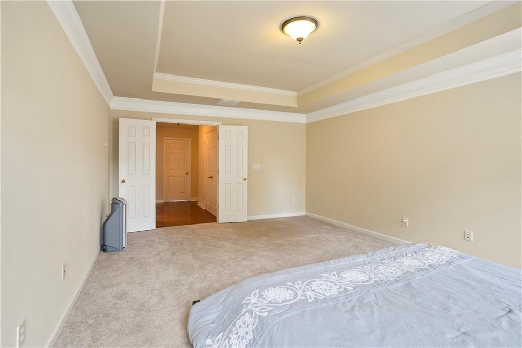 6108 Joybrook Road Johns Creek, GA 30097 - Photo 11 of 22 a bedroom with a bed and a window