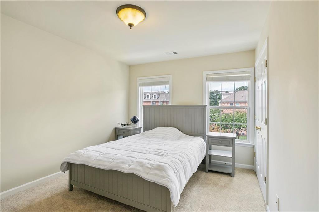 6108 Joybrook Road Johns Creek, GA 30097 - Photo 16 of 22 a bedroom with a bed and a window