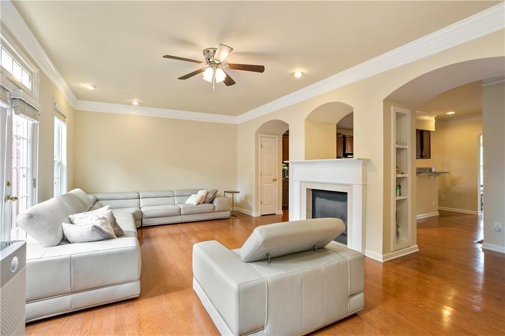 6108 Joybrook Road Johns Creek, GA 30097 - Photo 7 of 22 a living room with furniture and a fireplace