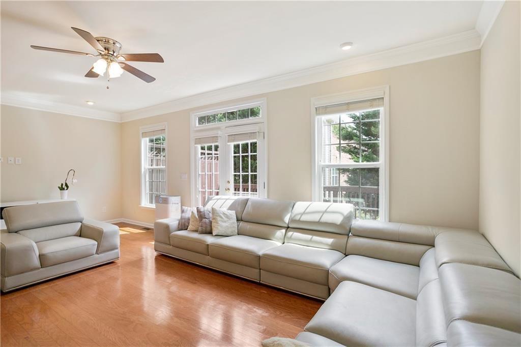 6108 Joybrook Road Johns Creek, GA 30097 - Photo 8 of 22 a living room with furniture and a large window
