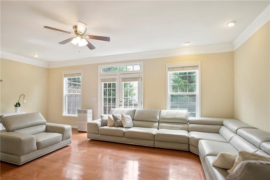 6108 Joybrook Road Johns Creek, GA 30097 - Photo 9 of 22 a living room with furniture and a large window