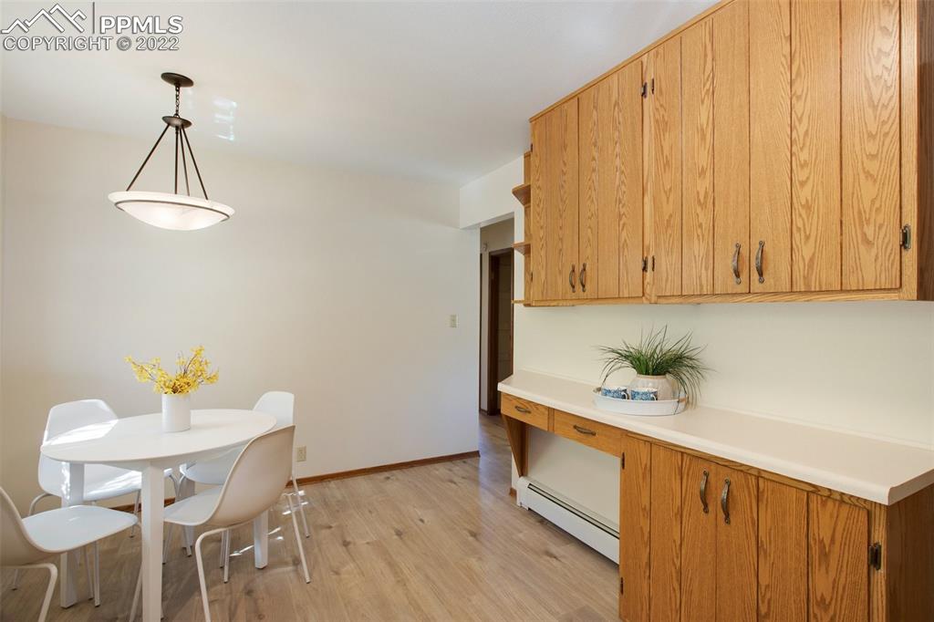 9610 Mohawk Trail Cascade, CO 80809 - Photo 13 of 38 a view of dining room and wooden floor