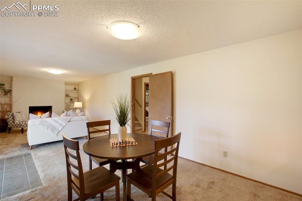 9610 Mohawk Trail Cascade, CO 80809 - Photo 19 of 38 a view of a dining room with furniture
