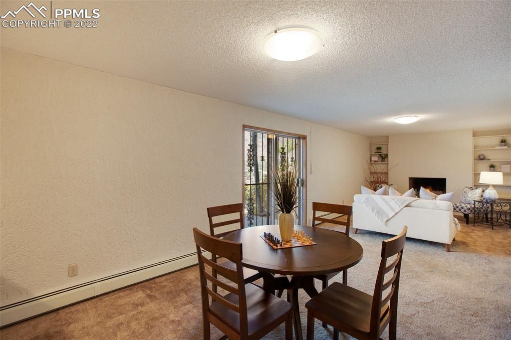 9610 Mohawk Trail Cascade, CO 80809 - Photo 22 of 38 a view of a dining room with furniture and window