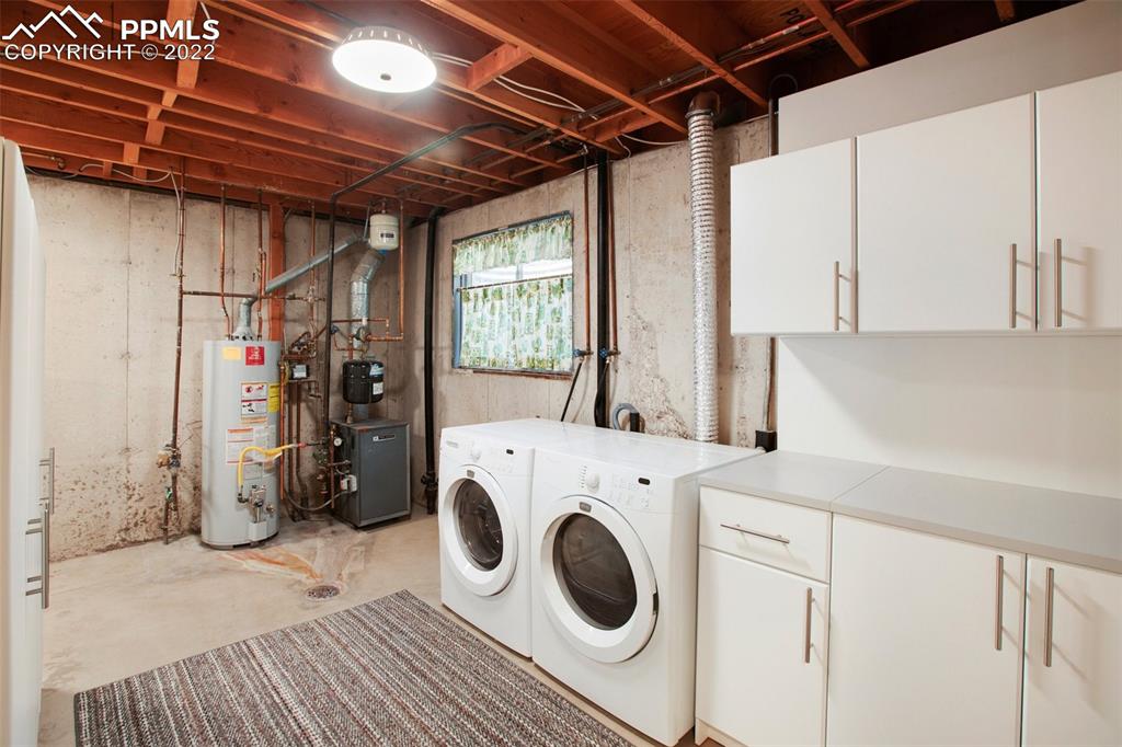 9610 Mohawk Trail Cascade, CO 80809 - Photo 27 of 38 a utility room with dryer and washer