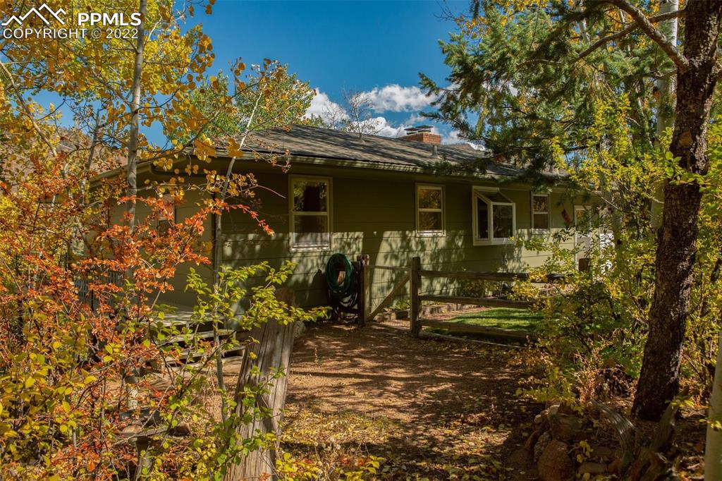 9610 Mohawk Trail Cascade, CO 80809 - Photo 31 of 38 a view of a house with yard