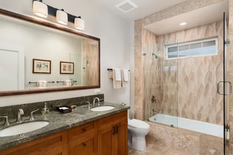 a bathroom with a shower and a bath tub