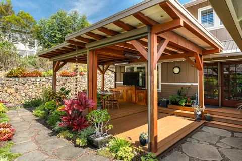 a view of outdoor dining space with furniture and floor to ceiling window