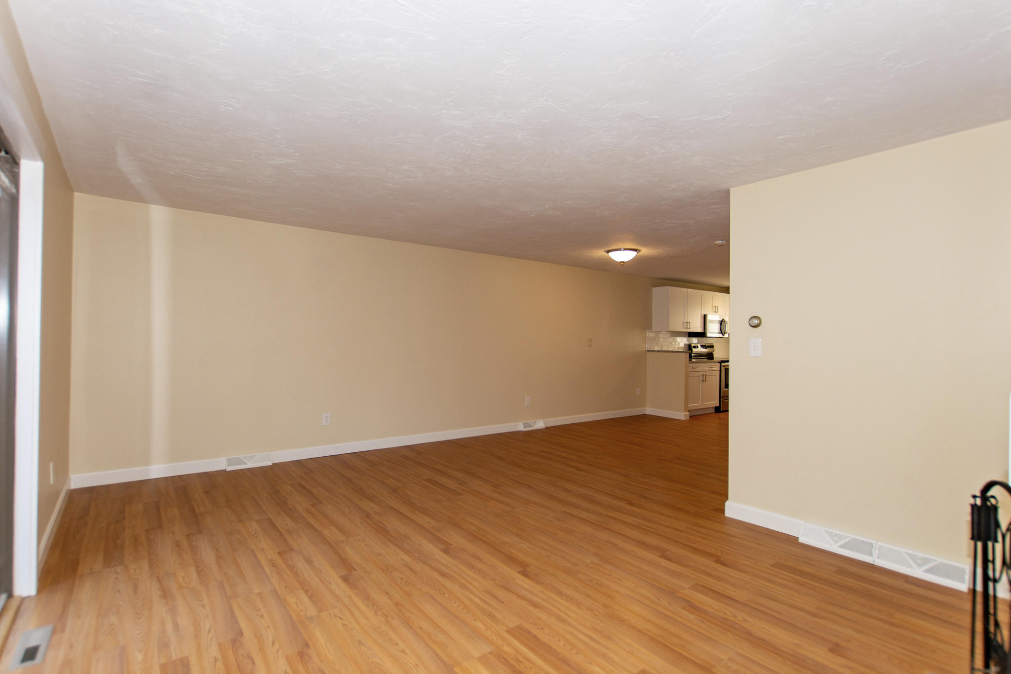52 Shellback Way, Unit H Mashpee, MA 02649 - Photo 12 of 20 a view of empty room with wooden floor