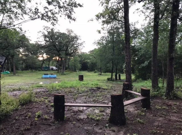 a view of a wooden deck with a backyard