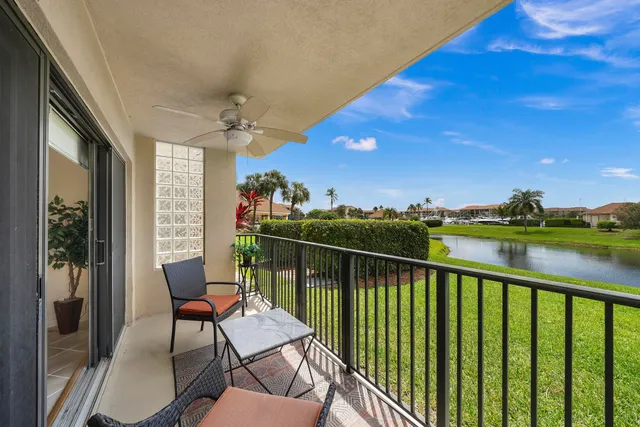 a view of a balcony with furniture