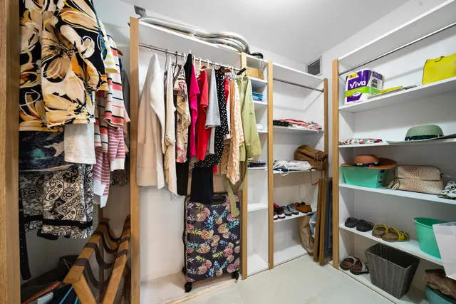 a bathroom with a tub shower and sink