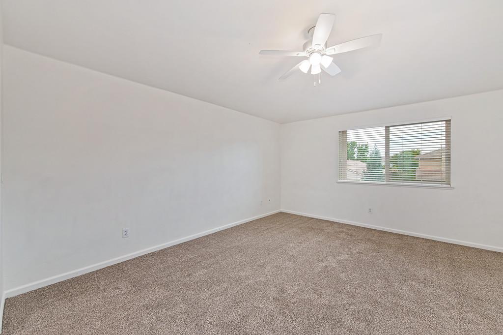 3524 Riojo Way Rancho Cordova, CA 95670 - Photo 25 of 47 an empty room with a window and a ceiling fan
