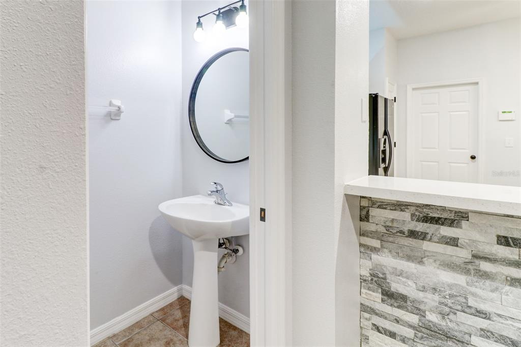 6243 Duck Key Court Tampa, FL 33625 - Photo 13 of 38 a bathroom with a sink and a mirror