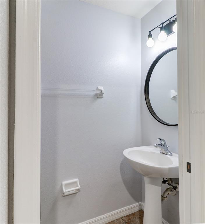 6243 Duck Key Court Tampa, FL 33625 - Photo 14 of 38 a bathroom with a sink and a mirror