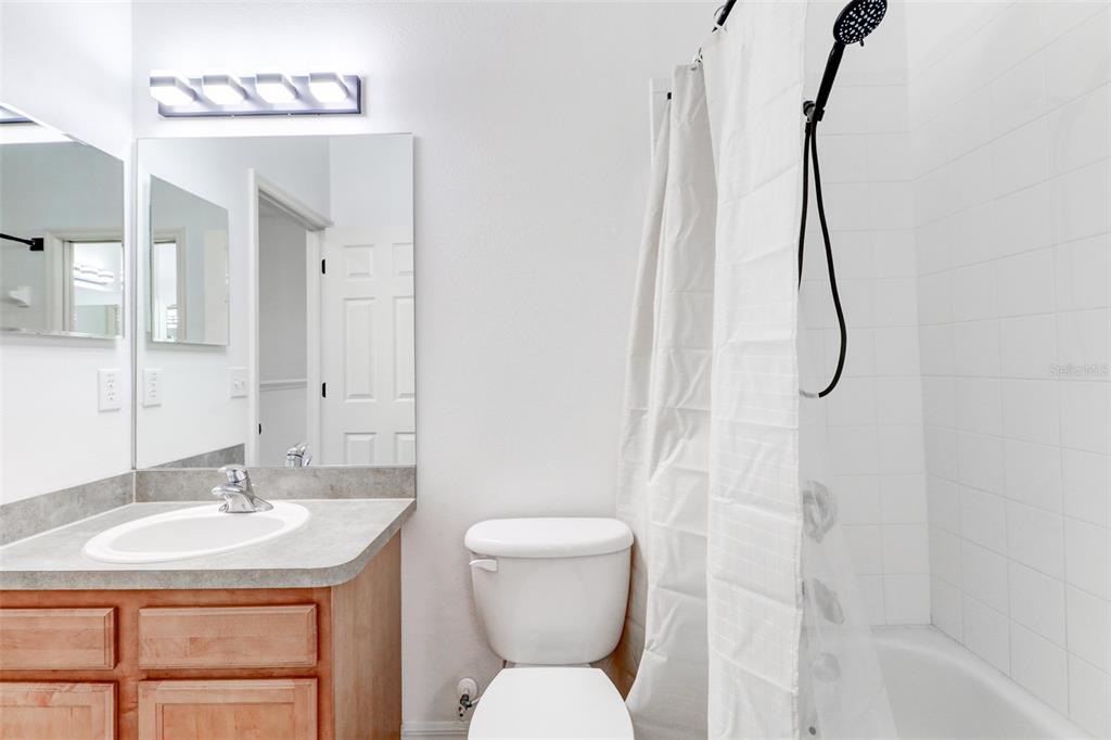 6243 Duck Key Court Tampa, FL 33625 - Photo 31 of 38 a bathroom with a sink toilet and shower