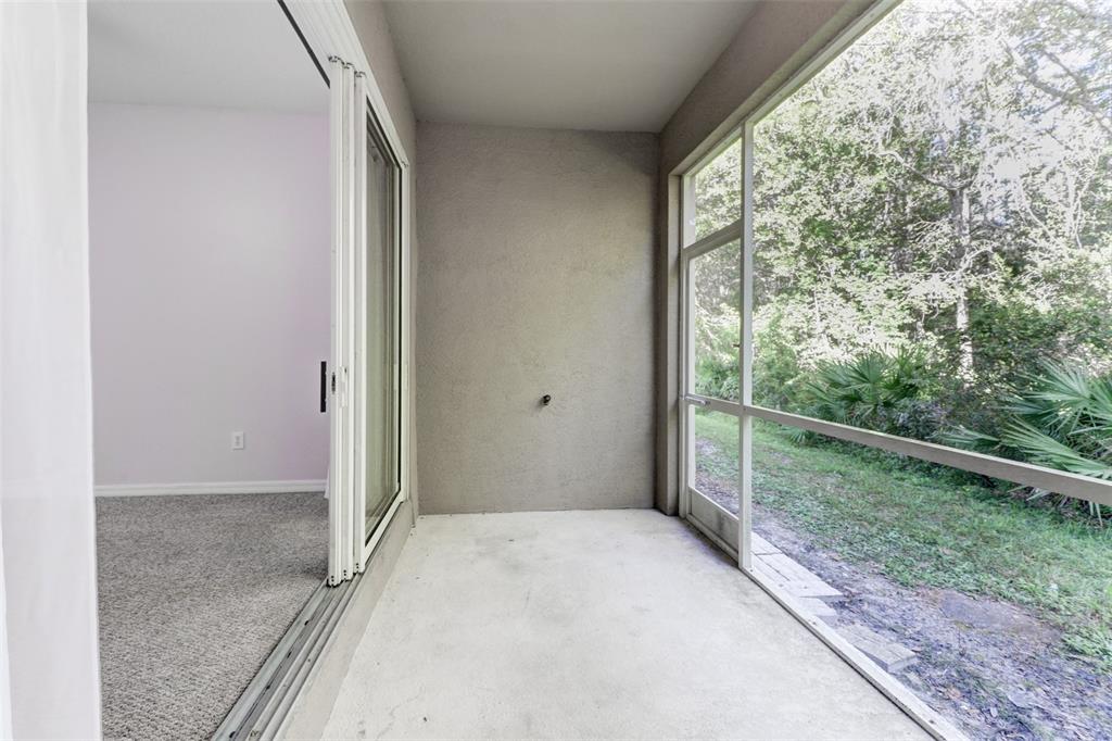 6243 Duck Key Court Tampa, FL 33625 - Photo 33 of 38 a view of a room with a large window and wooden floor
