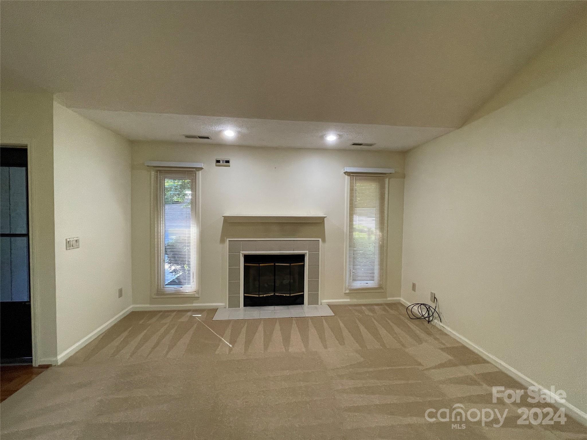 101 Independence Trail Morganton, NC 28655 - Photo 11 of 45 an empty room with a fireplace