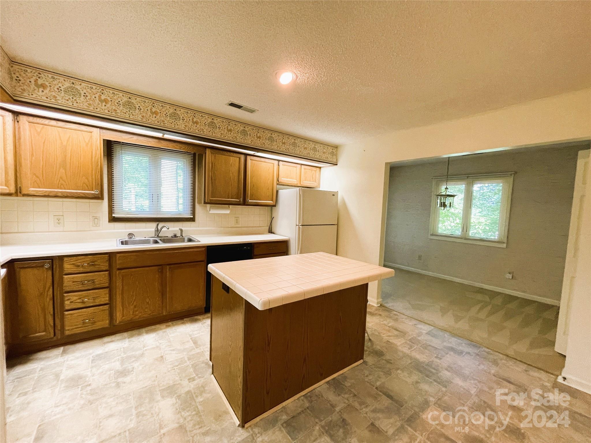 101 Independence Trail Morganton, NC 28655 - Photo 15 of 45 a kitchen with a sink stove and cabinets