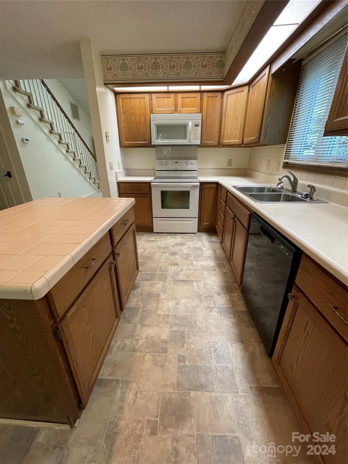 101 Independence Trail Morganton, NC 28655 - Photo 16 of 45 a kitchen with a sink stove and cabinets