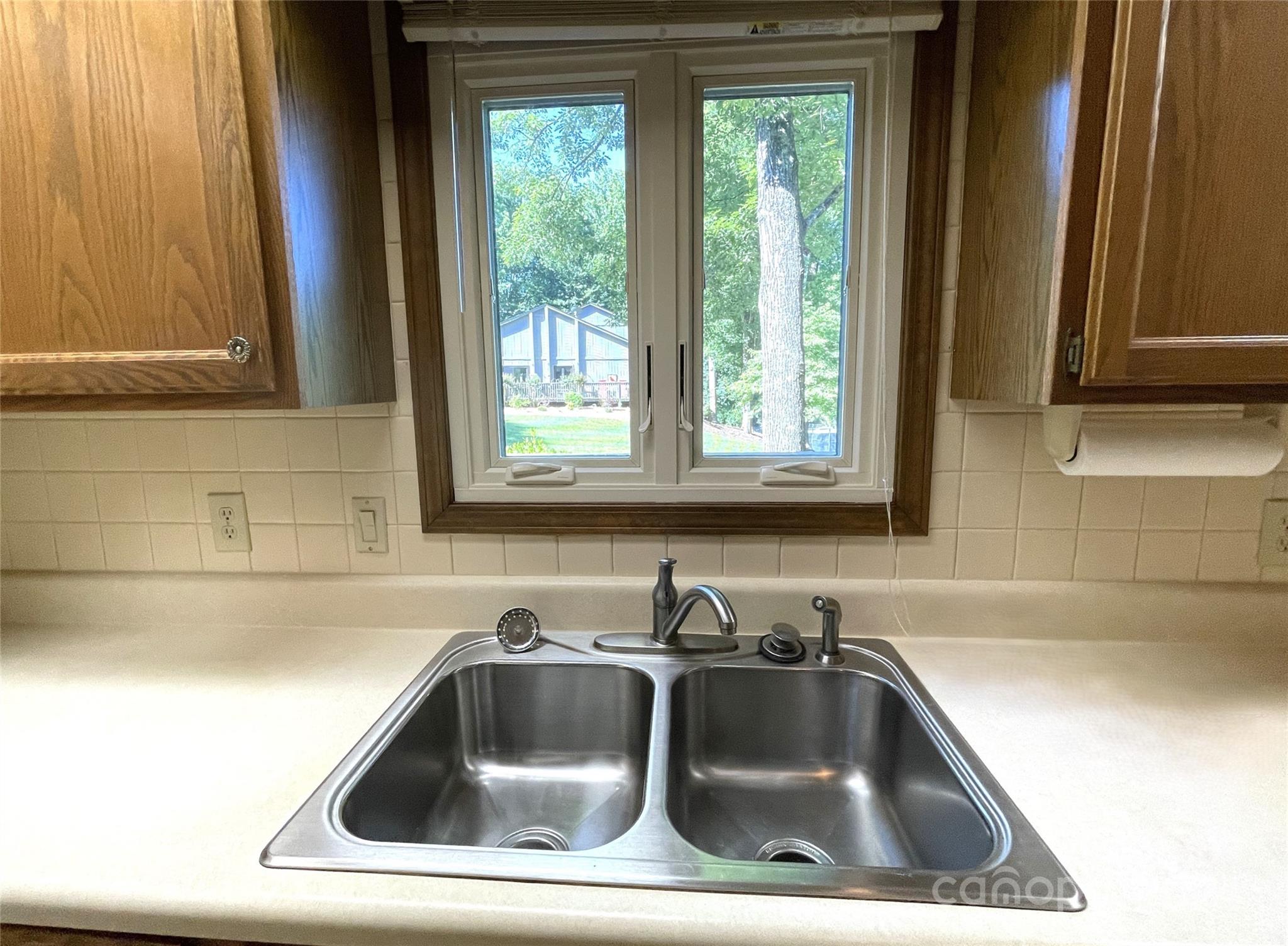 101 Independence Trail Morganton, NC 28655 - Photo 17 of 45 a sink and dishwasher next to a window