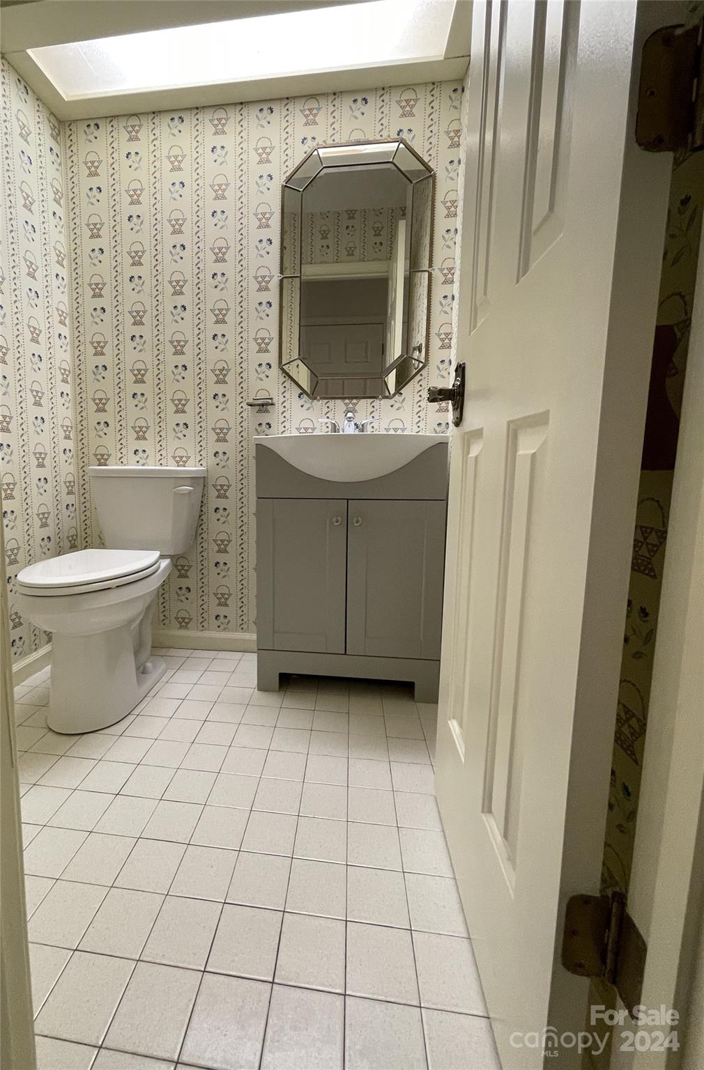 101 Independence Trail Morganton, NC 28655 - Photo 19 of 45 a bathroom with a toilet a sink and a mirror
