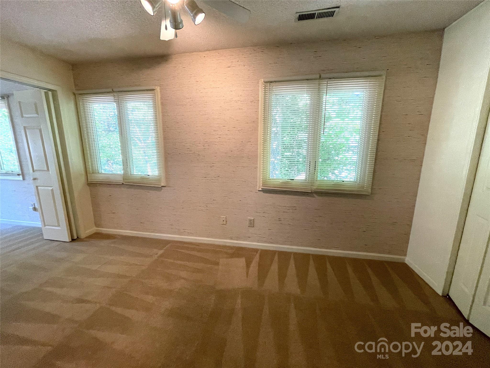 101 Independence Trail Morganton, NC 28655 - Photo 27 of 45 an empty room with wooden floor and windows