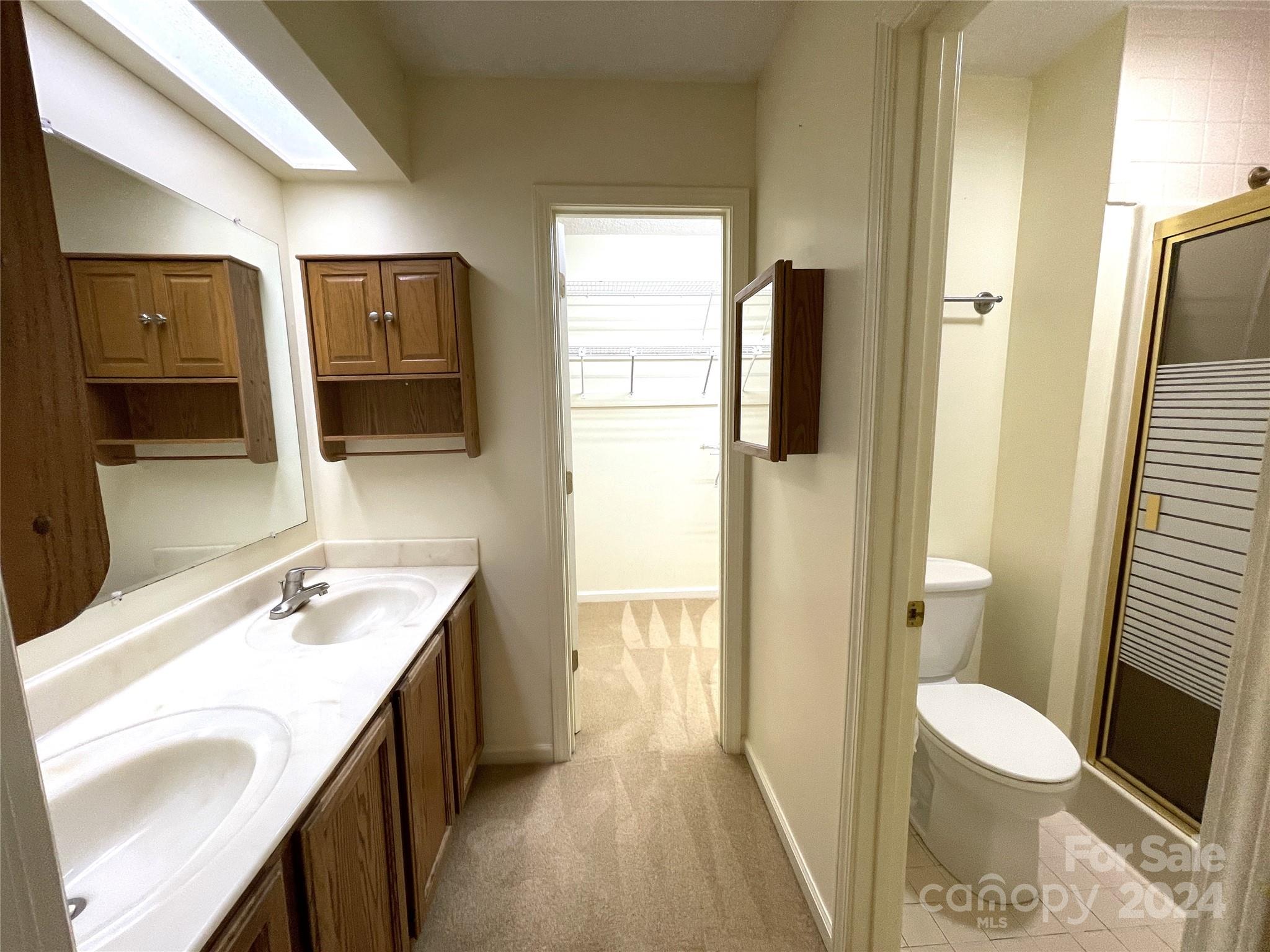 101 Independence Trail Morganton, NC 28655 - Photo 30 of 45 a bathroom with a sink a toilet and shower