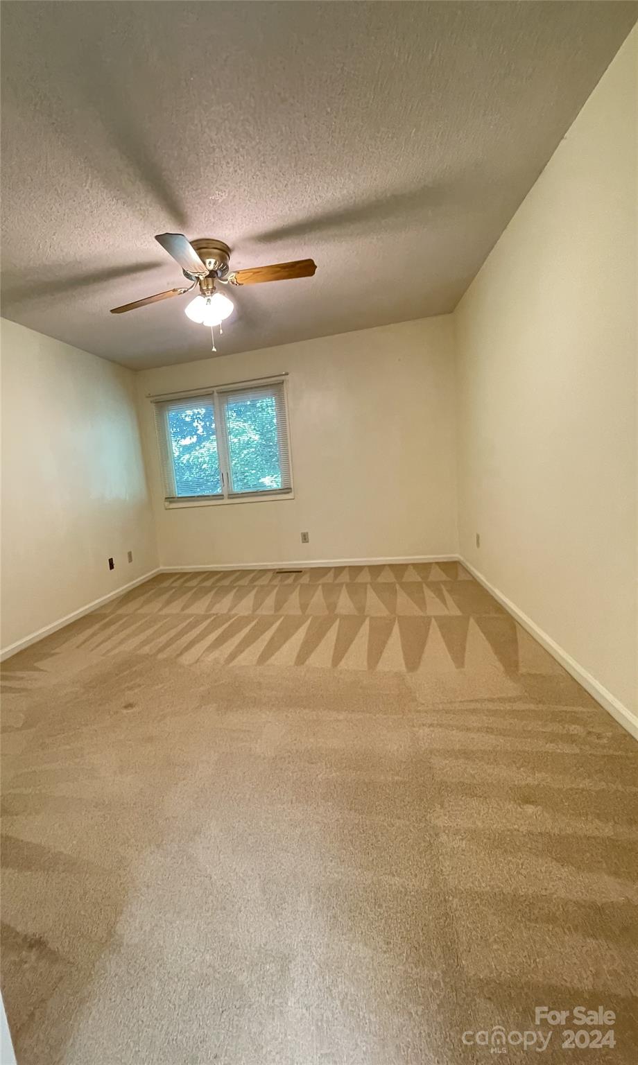 101 Independence Trail Morganton, NC 28655 - Photo 37 of 45 an empty room with a ceiling fan and window