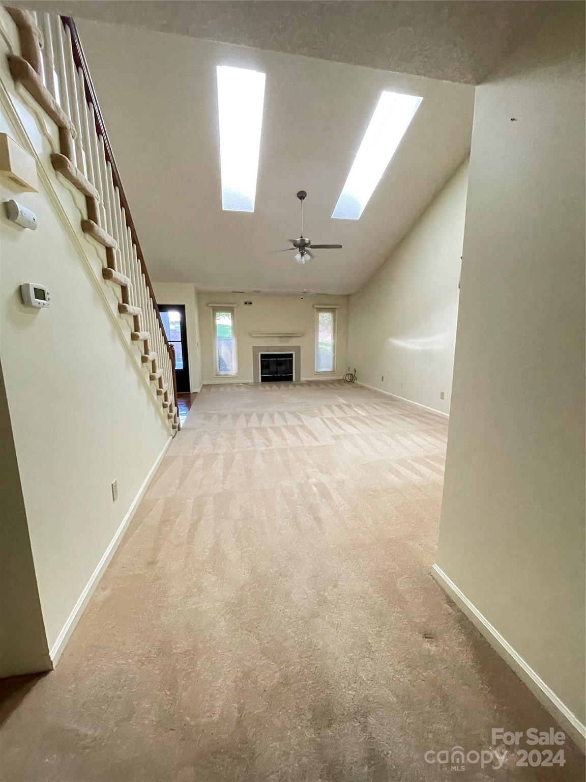 101 Independence Trail Morganton, NC 28655 - Photo 10 of 45 wooden floor in an empty room with a fireplace
