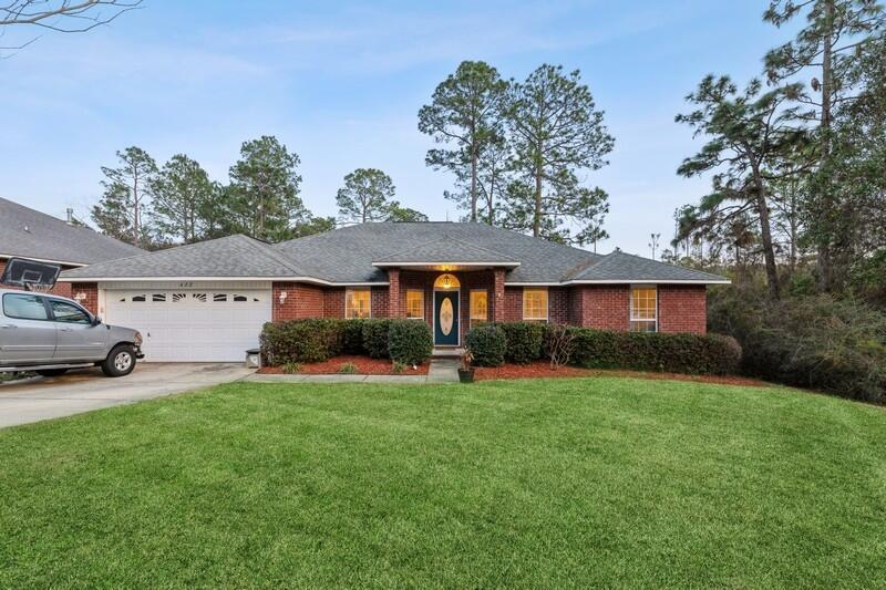 422 Swift Fox Run Crestview, FL 32536 - Photo 1 of 35 a view of a house with a yard and sitting area