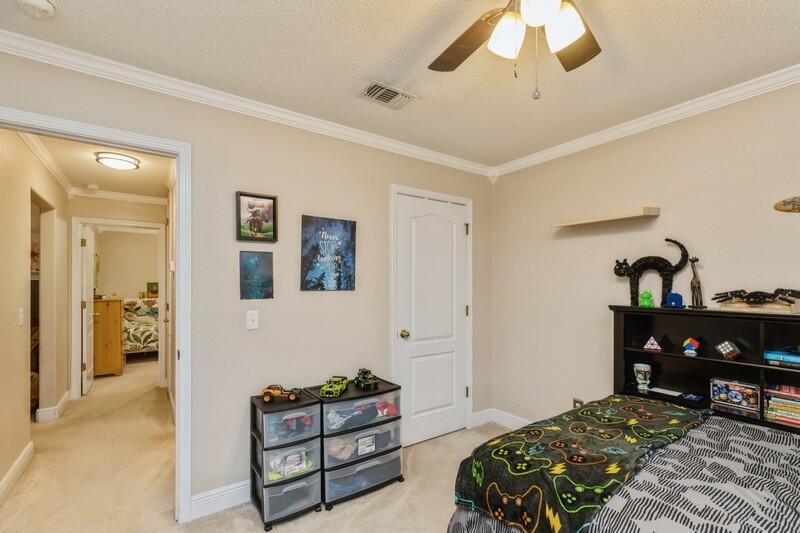 422 Swift Fox Run Crestview, FL 32536 - Photo 19 of 35 a bedroom with furniture and wooden floor