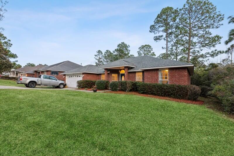 422 Swift Fox Run Crestview, FL 32536 - Photo 2 of 35 a front view of house with yard and green space
