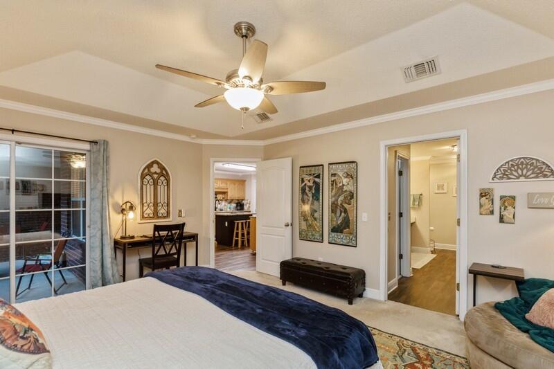 422 Swift Fox Run Crestview, FL 32536 - Photo 26 of 35 a bedroom with a bed and wooden floor