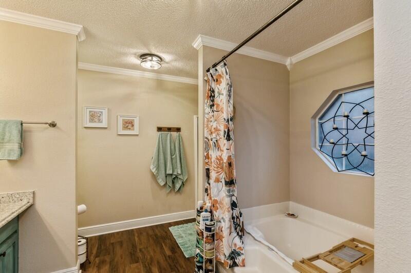 422 Swift Fox Run Crestview, FL 32536 - Photo 28 of 35 a bathroom with a tub sink and shower
