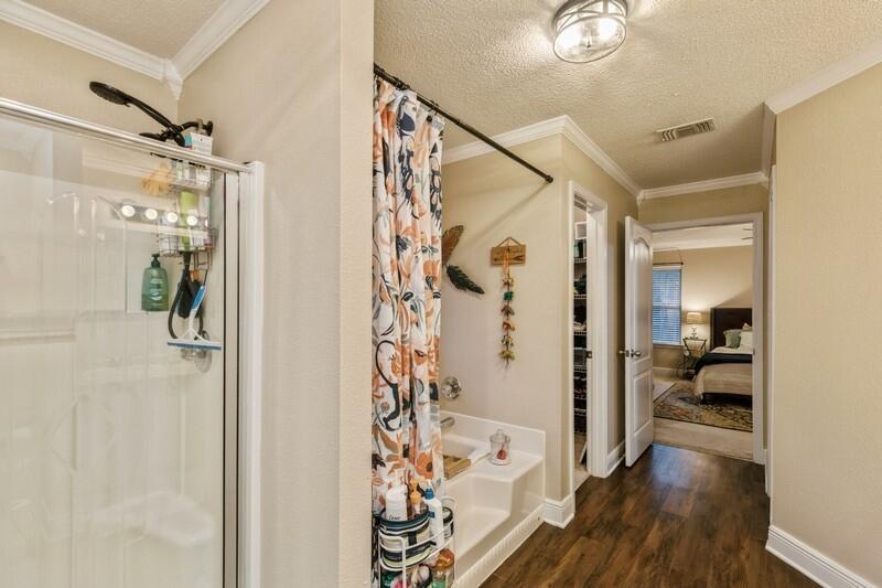 422 Swift Fox Run Crestview, FL 32536 - Photo 29 of 35 a bathroom with a bathtub and shower