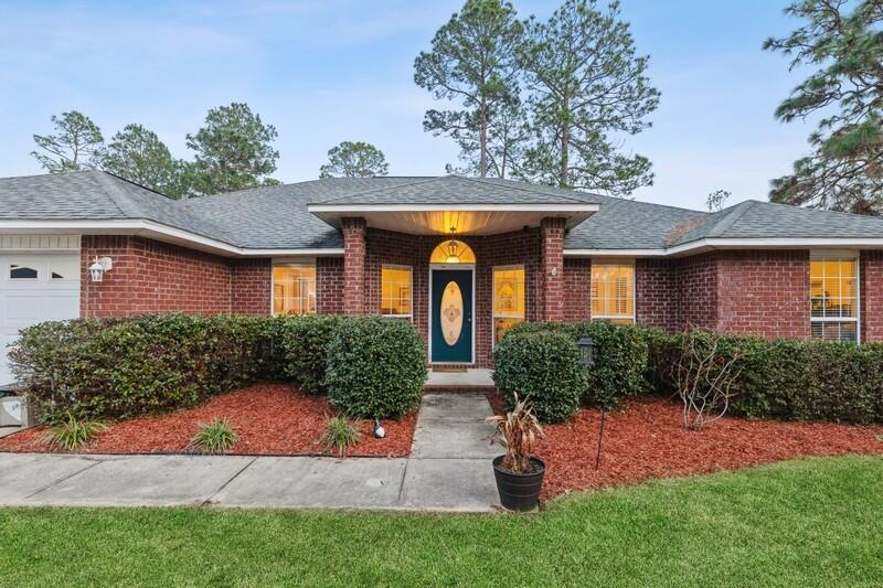 422 Swift Fox Run Crestview, FL 32536 - Photo 3 of 35 front view of a house with a yard