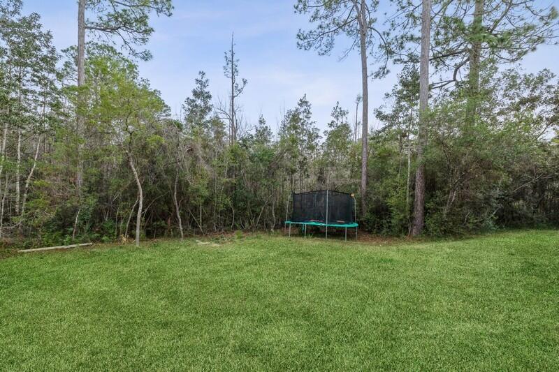 422 Swift Fox Run Crestview, FL 32536 - Photo 35 of 35 a backyard of a house with lots of green space