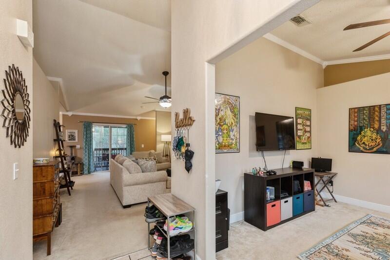 422 Swift Fox Run Crestview, FL 32536 - Photo 4 of 35 a living room with furniture and a flat screen tv
