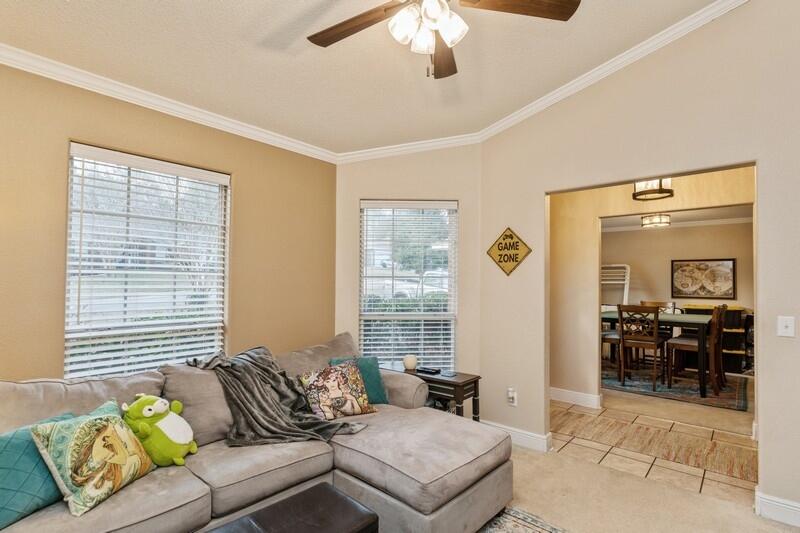 422 Swift Fox Run Crestview, FL 32536 - Photo 6 of 35 a living room with furniture and a large window