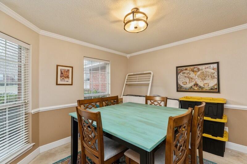 422 Swift Fox Run Crestview, FL 32536 - Photo 7 of 35 a view of a dining room with furniture window and wooden floor