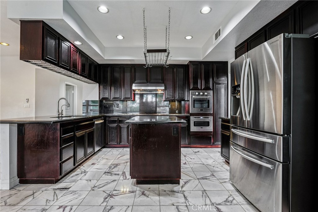 901 Clearwood Avenue Riverside, CA 92506 - Photo 1 of 36 a kitchen with stainless steel appliances granite countertop a refrigerator a stove a sink and a microwave