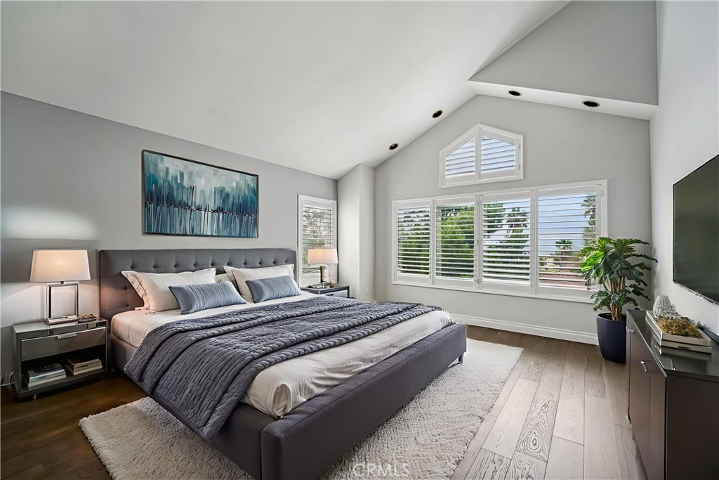 901 Clearwood Avenue Riverside, CA 92506 - Photo 13 of 36 a spacious bedroom with bed and a large window