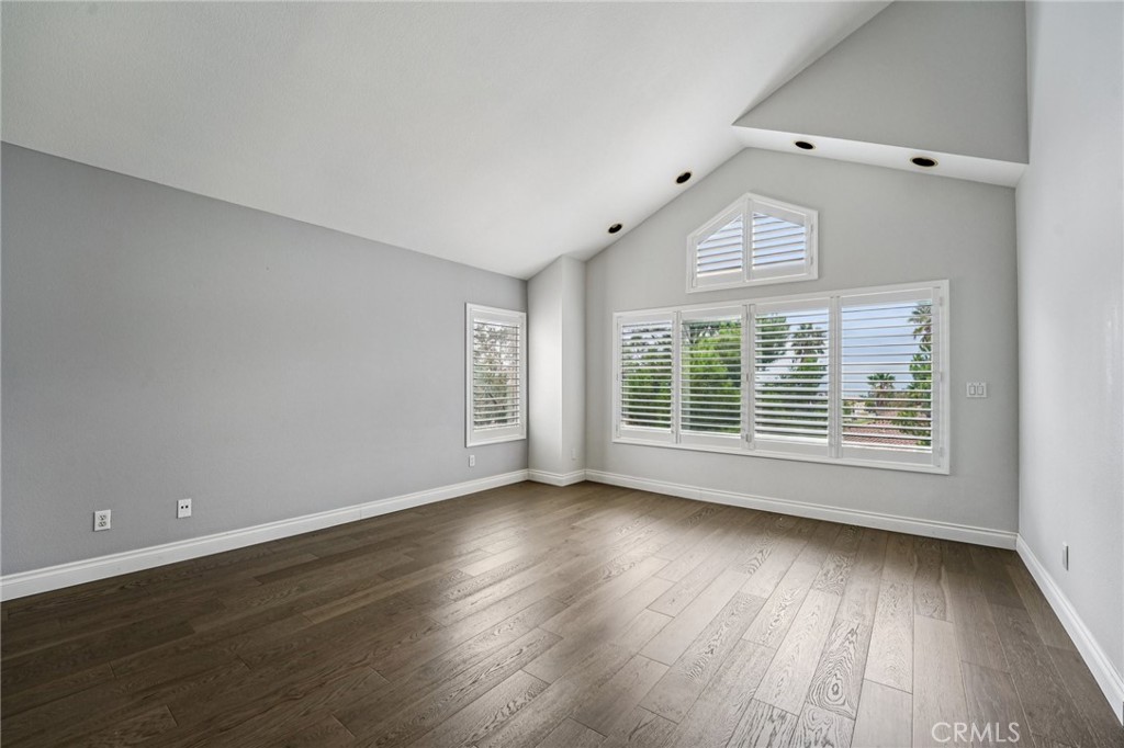 901 Clearwood Avenue Riverside, CA 92506 - Photo 14 of 36 a view of an empty room with wooden floor and a window